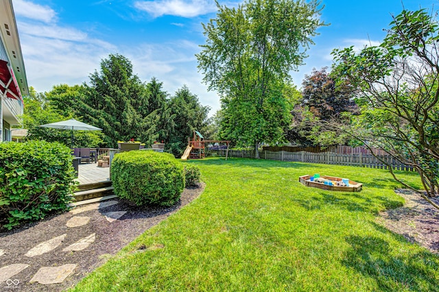 10717 Windermere Blvd, Fishers, IN 46037 - fenced backyard with a playground and a deck