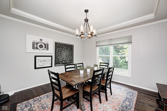 10717 Windermere Blvd, Fishers, IN 46037 - dining space featuring a tray ceiling, a chandelier, crown molding, and wood finished floors