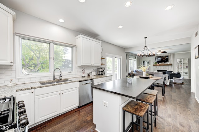 10717 Windermere Blvd, Fishers, IN 46037 - kitchen featuring dishwasher, range with gas stovetop, open floor plan, backsplash, and recessed lighting
