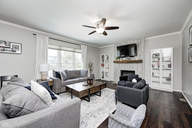 10717 Windermere Blvd, Fishers, IN 46037 - living area featuring a ceiling fan, a fireplace, dark wood-type flooring, and crown molding