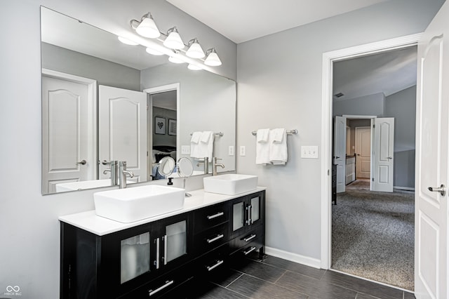 10717 Windermere Blvd, Fishers, IN 46037 - full bathroom featuring connected bathroom, double vanity, and lofted ceiling