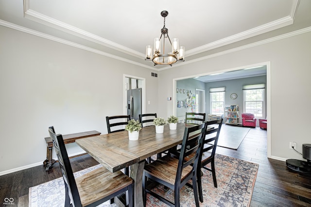 10717 Windermere Blvd, Fishers, IN 46037 - dining space with a chandelier, wood finished floors, crown molding, and a tray ceiling