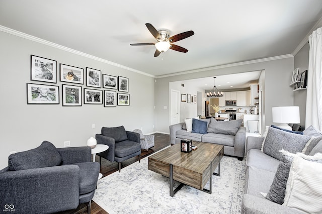 10717 Windermere Blvd, Fishers, IN 46037 - living room with ceiling fan, wood finished floors, ornamental molding, and a chandelier