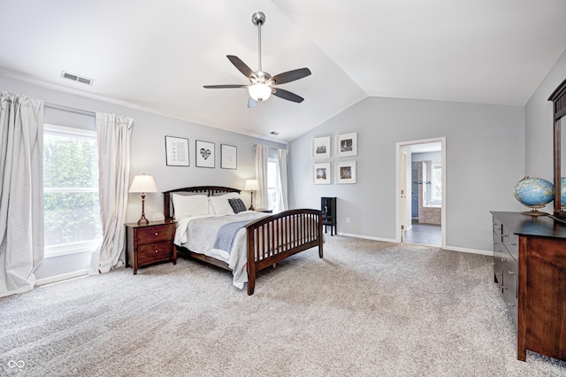 10717 Windermere Blvd, Fishers, IN 46037 - carpeted bedroom featuring multiple windows, vaulted ceiling, a ceiling fan, and ensuite bathroom