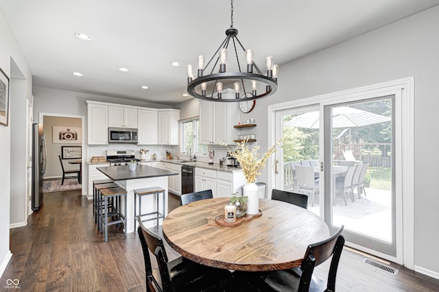 10717 Windermere Blvd, Fishers, IN 46037 - dining space with a chandelier, recessed lighting, and dark wood finished floors