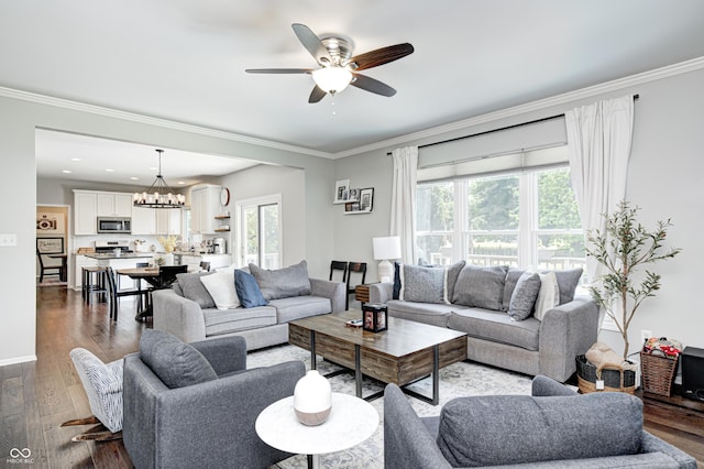 10717 Windermere Blvd, Fishers, IN 46037 - living area with a chandelier, a ceiling fan, healthy amount of natural light, wood finished floors, and crown molding
