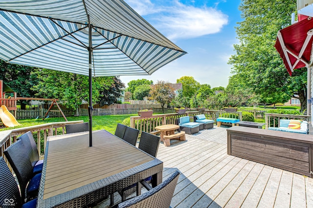 10717 Windermere Blvd, Fishers, IN 46037 - wooden deck featuring a fenced backyard, a playground, and outdoor dining space
