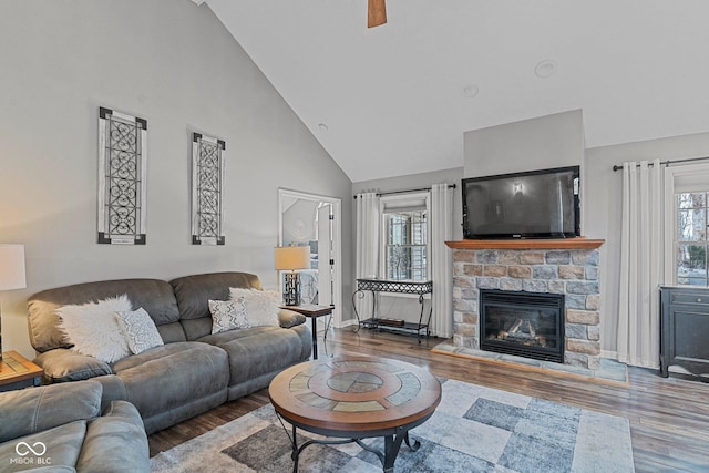 128 Walts Rd, Georgetown, IN 47122 - living room featuring high vaulted ceiling, wood finished floors, a ceiling fan, baseboards, and a fireplace