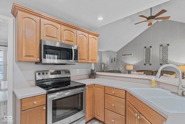 128 Walts Rd, Georgetown, IN 47122 - kitchen featuring stainless steel appliances, a sink, lofted ceiling, light countertops, and a ceiling fan