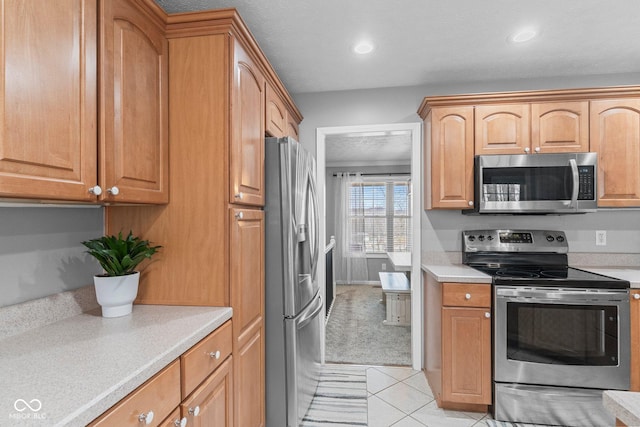 128 Walts Rd, Georgetown, IN 47122 - kitchen featuring stainless steel appliances, light countertops, light tile patterned floors, and recessed lighting