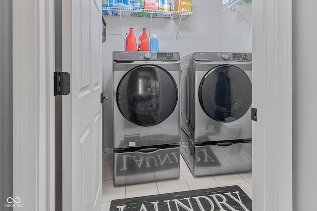 128 Walts Rd, Georgetown, IN 47122 - laundry area featuring washing machine and clothes dryer and tile patterned flooring