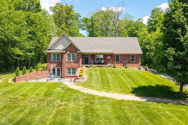 128 Walts Rd, Georgetown, IN 47122 - view of front of home featuring a patio area, brick siding, a front yard, and a shingled roof