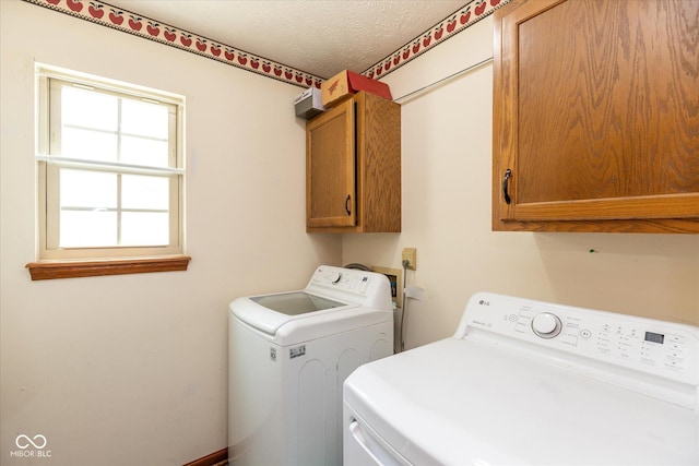 1159 Oak Leaf Rd, Franklin, IN 46131 - washroom featuring cabinet space, washer and clothes dryer, and a textured ceiling