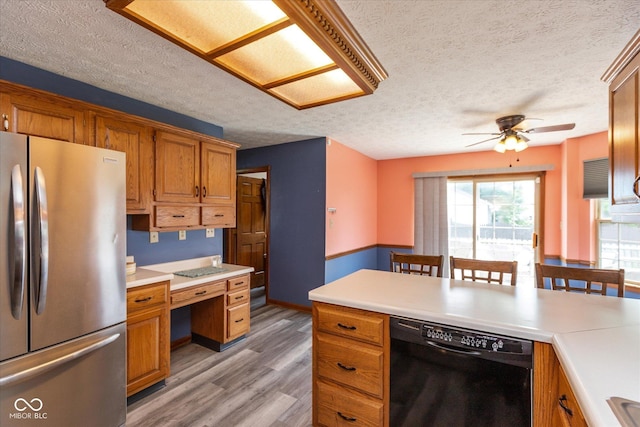 1159 Oak Leaf Rd, Franklin, IN 46131 - kitchen with dishwasher, freestanding refrigerator, a textured ceiling, light countertops, and a ceiling fan