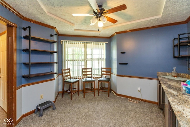 1159 Oak Leaf Rd, Franklin, IN 46131 - sitting room with a textured ceiling, a ceiling fan, carpet flooring, a raised ceiling, and crown molding