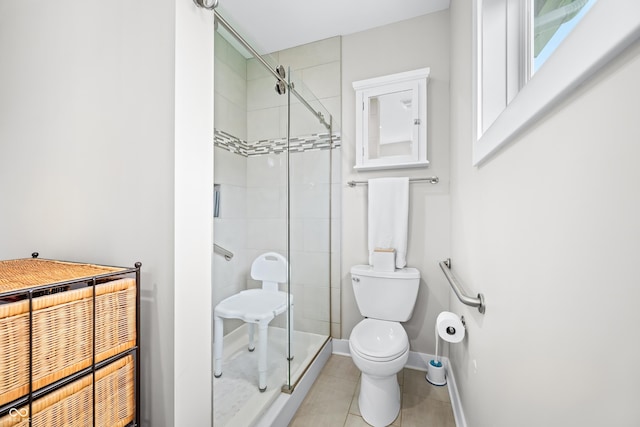 655 N Sobota Way, Trafalgar, IN 46181 - full bath with toilet, a stall shower, tile patterned flooring, and baseboards