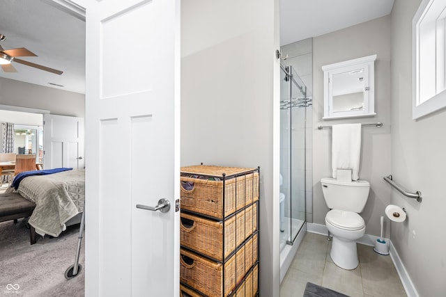 655 N Sobota Way, Trafalgar, IN 46181 - full bathroom with a shower stall, ensuite bathroom, ceiling fan, toilet, and baseboards