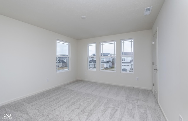 7151 Firestone Rd, Whitestown, IN 46052 - spare room featuring light colored carpet, healthy amount of natural light, and baseboards