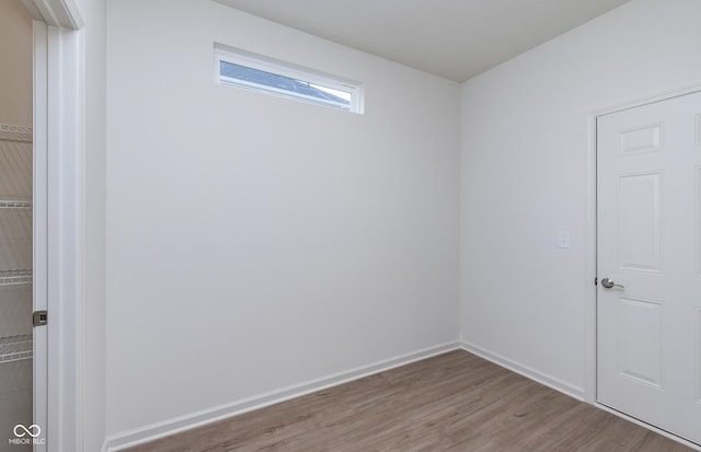 7151 Firestone Rd, Whitestown, IN 46052 - empty room with wood finished floors and baseboards