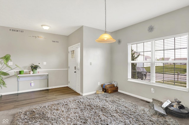 10902 Jimmy Lake Dr, Indianapolis, IN 46239 - entryway with baseboards and wood finished floors