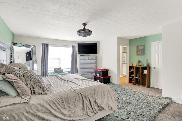10902 Jimmy Lake Dr, Indianapolis, IN 46239 - carpeted bedroom featuring a textured ceiling and connected bathroom