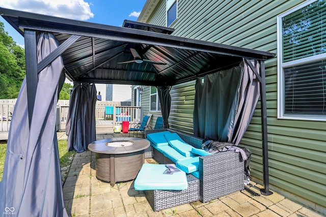 10902 Jimmy Lake Dr, Indianapolis, IN 46239 - view of patio with a gazebo, a ceiling fan, and an outdoor fire pit