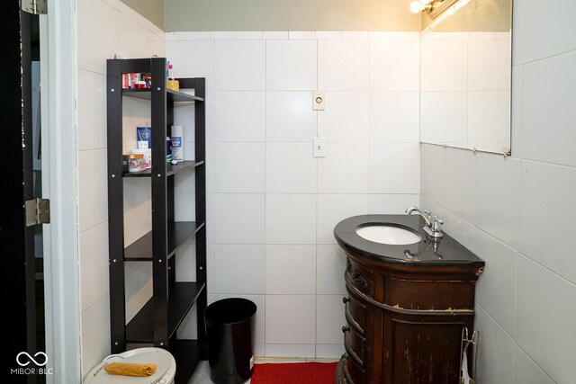 6180 Winnpeny Ln, Indianapolis, IN 46220 - half bathroom featuring tile walls and vanity