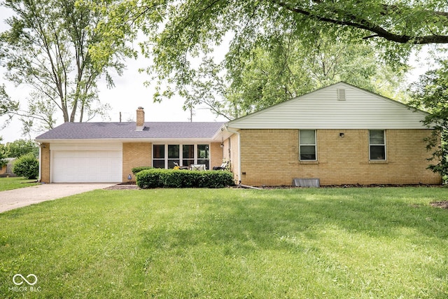 6180 Winnpeny Ln, Indianapolis, IN 46220 - single story home featuring brick siding, a garage, concrete driveway, a chimney, and a front yard