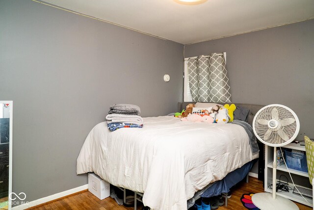 6180 Winnpeny Ln, Indianapolis, IN 46220 - bedroom with wood finished floors and baseboards