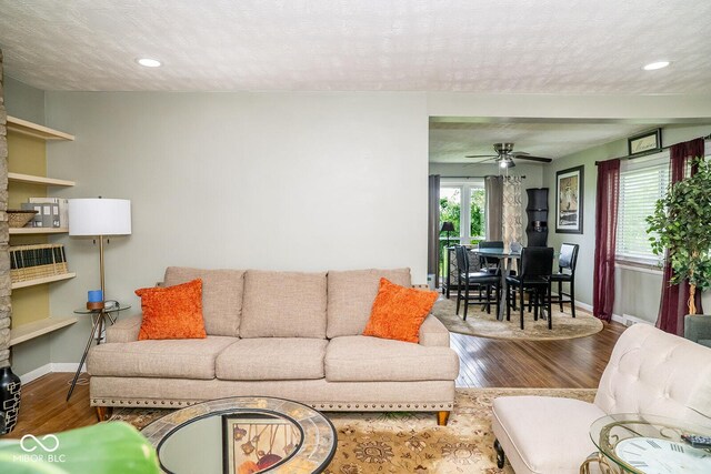 6180 Winnpeny Ln, Indianapolis, IN 46220 - living room with wood finished floors, baseboards, a ceiling fan, and recessed lighting