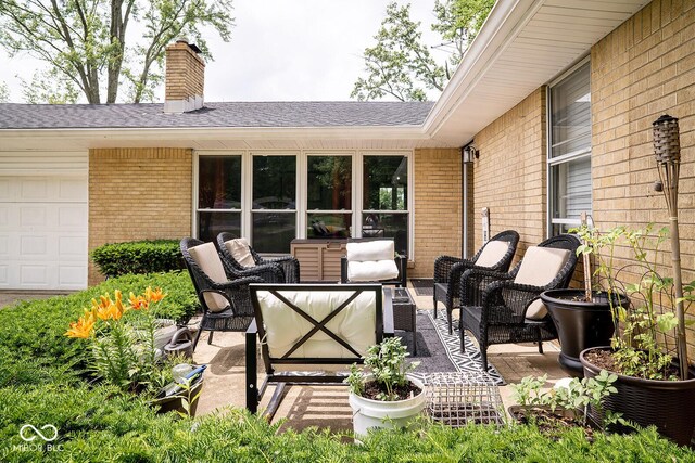 6180 Winnpeny Ln, Indianapolis, IN 46220 - view of patio / terrace featuring an outdoor hangout area and a garage