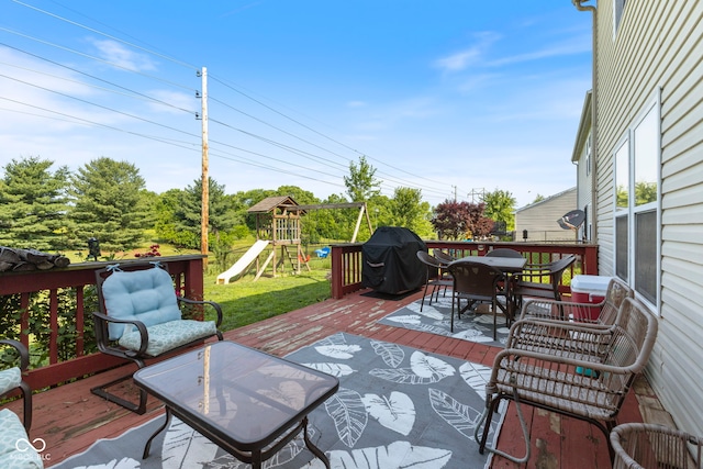 6608 Sonesta Dr, Indianapolis, IN 46217 - deck with grilling area, outdoor dining area, a playground, and a yard