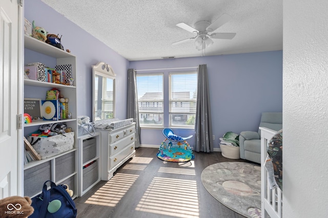 6608 Sonesta Dr, Indianapolis, IN 46217 - bedroom with a textured ceiling, wood finished floors, and a ceiling fan