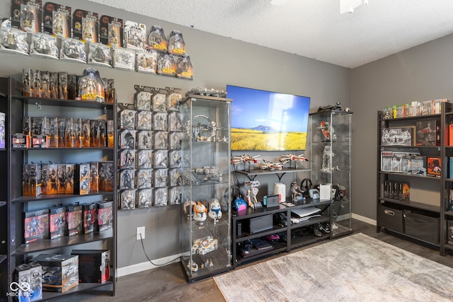 6608 Sonesta Dr, Indianapolis, IN 46217 - miscellaneous room with wood finished floors and a textured ceiling