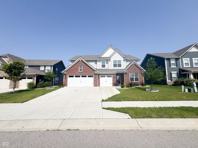 2358 S Stonehill Way, New Palestine, IN 46163 - view of front of home with driveway, brick siding, a front lawn, and an attached garage