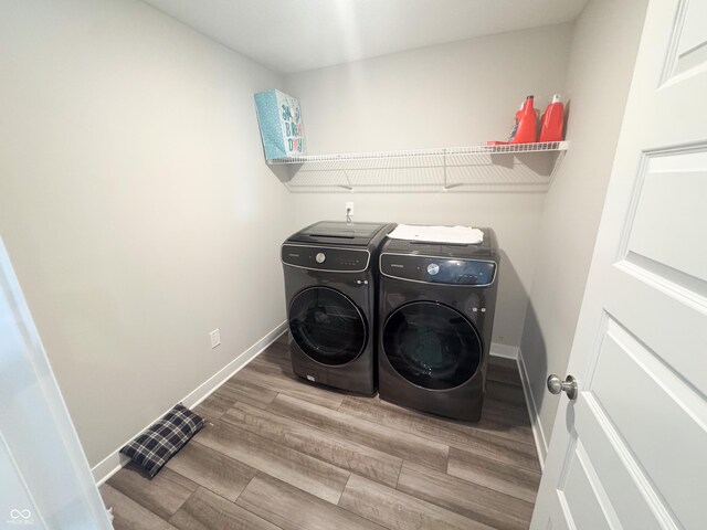 2358 S Stonehill Way, New Palestine, IN 46163 - laundry area with washing machine and dryer and wood finished floors