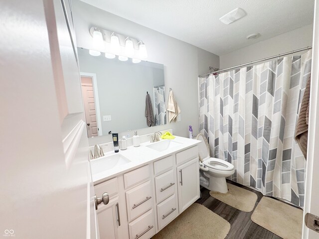 2358 S Stonehill Way, New Palestine, IN 46163 - full bathroom with wood finished floors, double vanity, and curtained shower