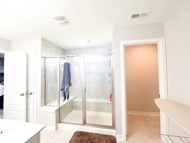 2358 S Stonehill Way, New Palestine, IN 46163 - full bathroom with a stall shower, vanity, tile patterned flooring, and a textured ceiling