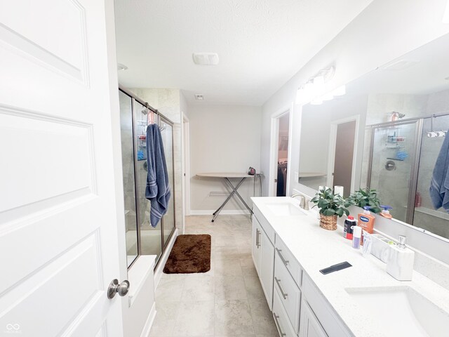2358 S Stonehill Way, New Palestine, IN 46163 - full bath with double vanity, a stall shower, a walk in closet, and tile patterned flooring