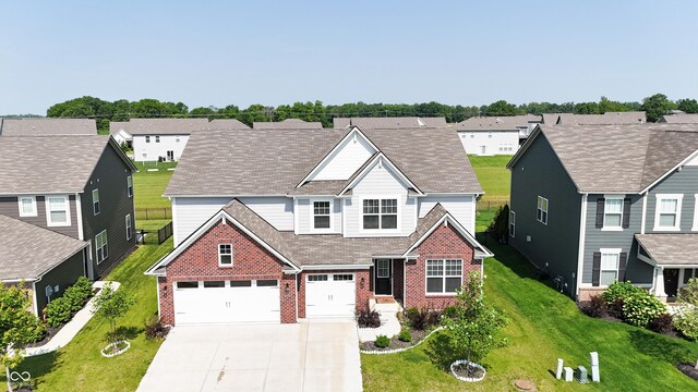 2358 S Stonehill Way, New Palestine, IN 46163 - traditional-style house featuring brick siding, concrete driveway, and a residential view