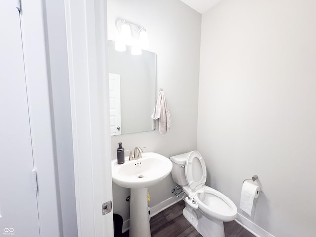 2358 S Stonehill Way, New Palestine, IN 46163 - half bathroom featuring toilet and wood finished floors