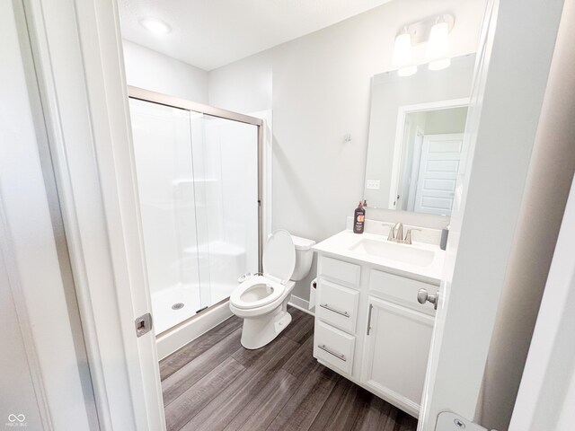 2358 S Stonehill Way, New Palestine, IN 46163 - full bath featuring wood finished floors, vanity, and a stall shower