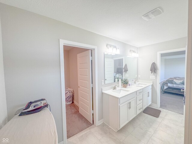 2358 S Stonehill Way, New Palestine, IN 46163 - ensuite bathroom with double vanity and tile patterned floors