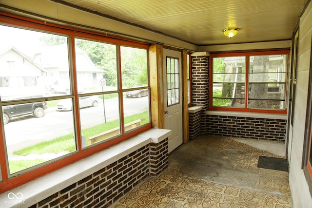 1115 N Kealing Ave, Indianapolis, IN 46201 - unfurnished sunroom featuring plenty of natural light and brick wall