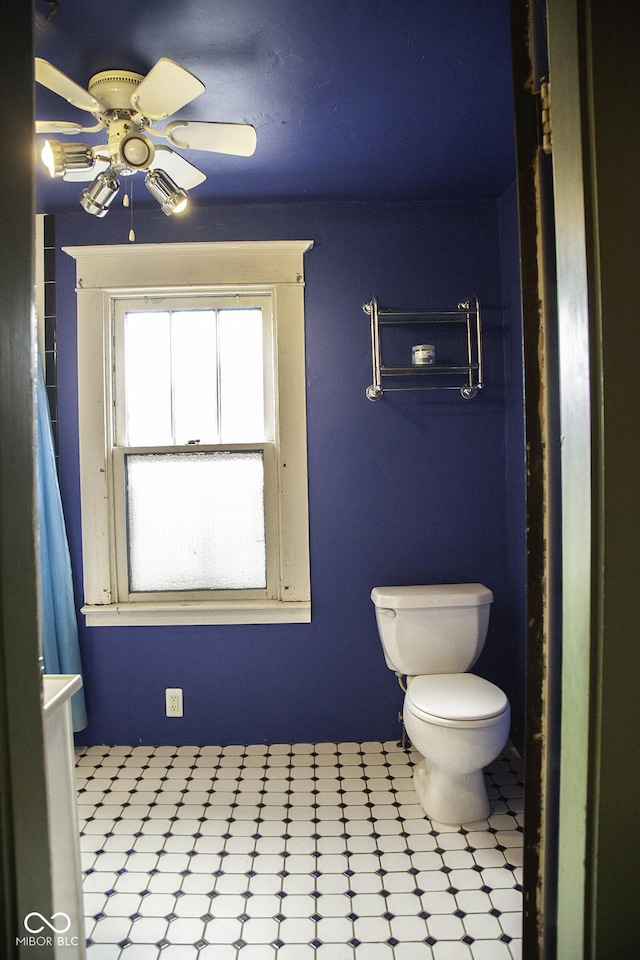 1115 N Kealing Ave, Indianapolis, IN 46201 - bathroom featuring toilet, a ceiling fan, and tile patterned floors