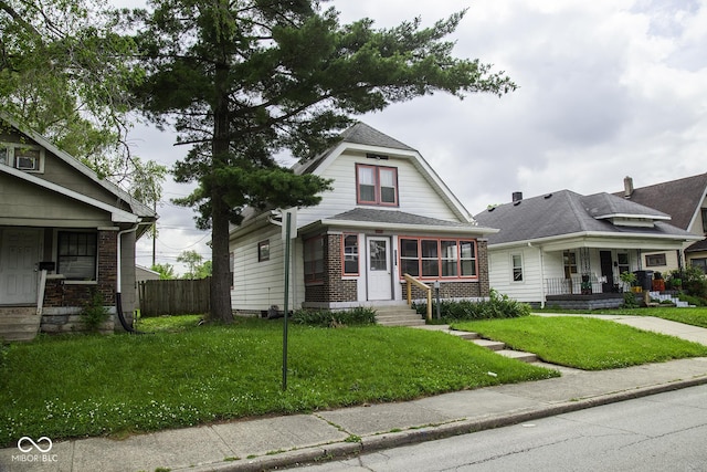 1115 N Kealing Ave, Indianapolis, IN 46201 - view of front of home featuring brick siding and covered porch