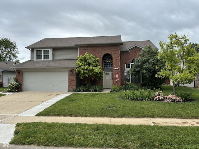 8926 Durban Ct, Indianapolis, IN 46234 - view of front of home featuring concrete driveway, an attached garage, a front yard, and brick siding