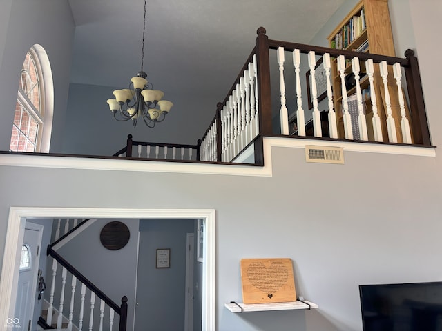 8926 Durban Ct, Indianapolis, IN 46234 - stairway featuring a chandelier and healthy amount of natural light