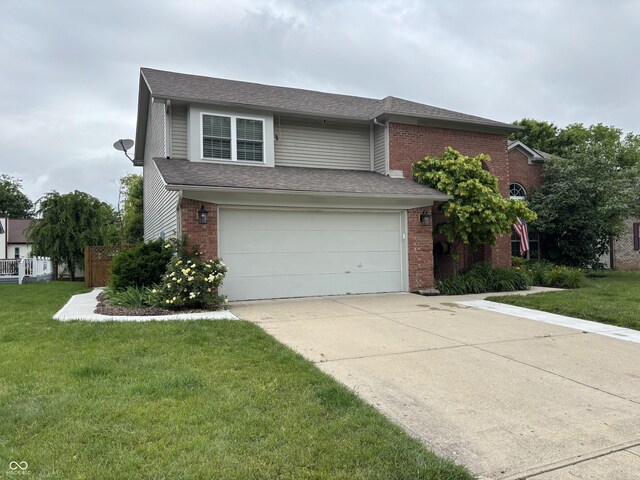 8926 Durban Ct, Indianapolis, IN 46234 - view of front of property with an attached garage, brick siding, driveway, and a front yard