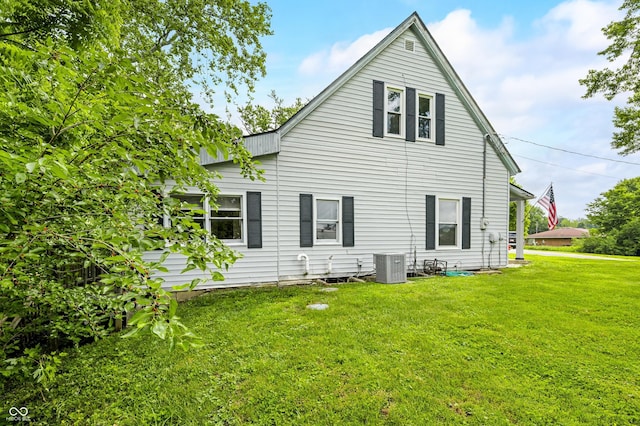 379 N Marion St, Morgantown, IN 46160 - rear view of house featuring a lawn and central AC